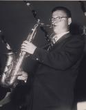 Musician playing saxophone on stage