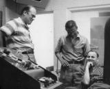 Colleagues gathered around a desk in conversation
