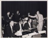 Big band playing instruments on stage