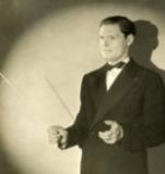 Elegant man in tuxedo conducting