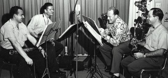 Musicians rehearsing in a recording studio